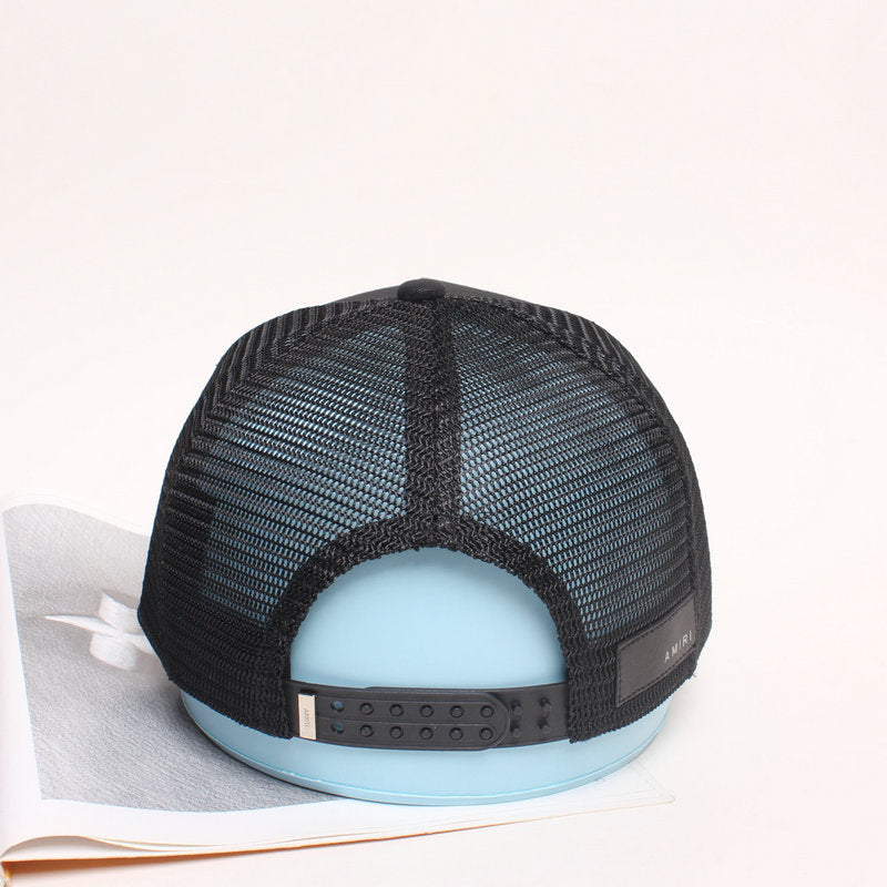 AMIRI star-patch paneled trucker cap